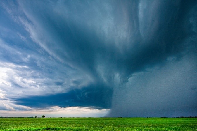 A severe summertime convective storm unleashes rain over farmland in Oklahoma. Surface heat pushes moisture higher in the atmosphere, creating potentially damaging thunderstorms.