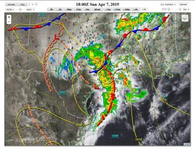 An impressive mesoscale convective system over eastern Texas with a comma-shaped configuration. 